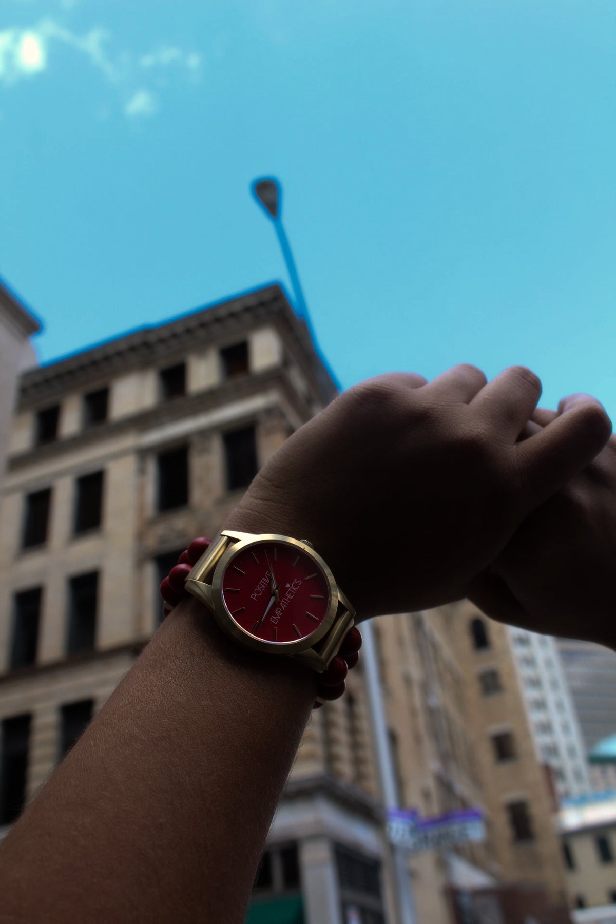 Positive Empathetic's beaded watch photographed at 4:12 PM in daylight