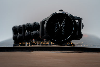 Positive Empathetic's Matte Black Beaded Watch, 38mm lava rock bracelet — dial and bracelet detail