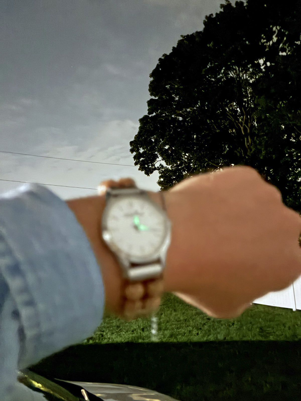 Positive Empathetic's beaded watch at 9:40 PM, the lume glowing on the dial